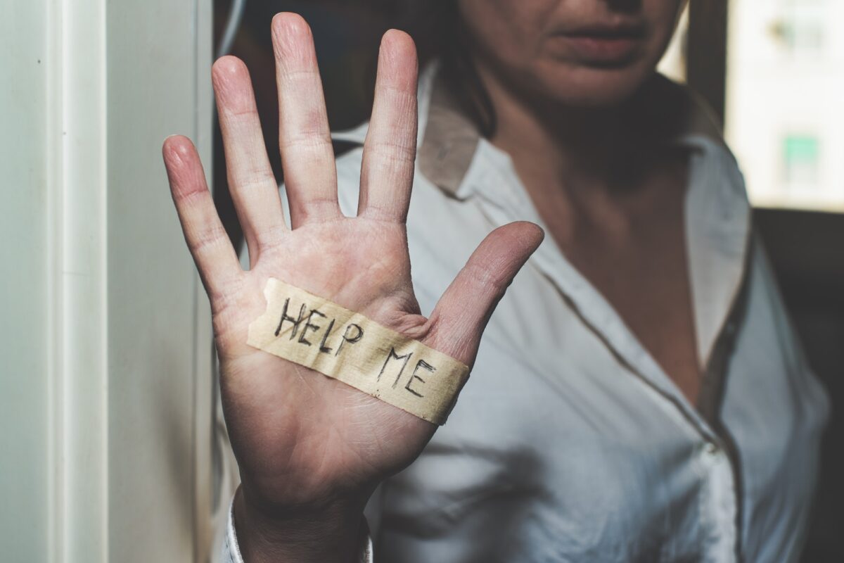 Woman's hand that says help me